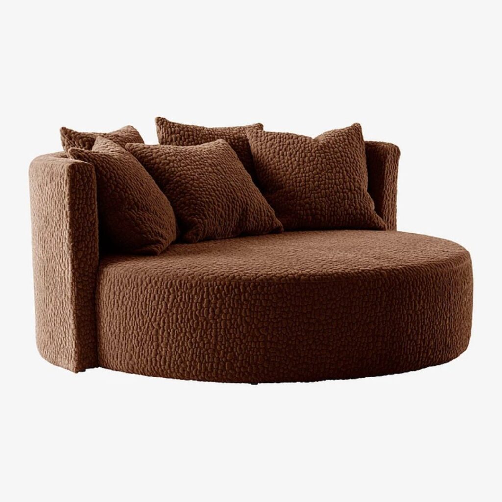 Brun rund soffa med teddy material skapar en intressant och bekväm sittplats att mysa på Brun rund soffa med teddy material skapar en intressant och bekväm sittplats att mysa på.